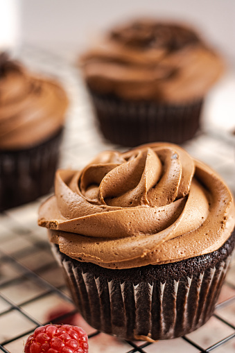 Homemade delicious cupcakes with chocolate buttercream.