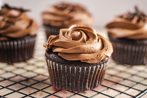 Homemade delicious cupcakes with chocolate buttercream.