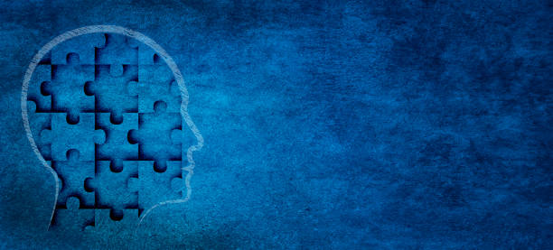 Head made of jigsaw puzzle on textured abstract blue wall background