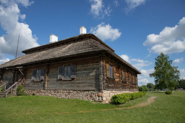 istock an old wooden house with a thatched roof. 1466605399
