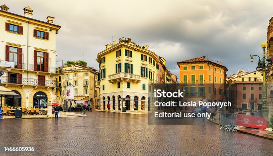 Cityscape of Verona with Piazza Bra of Verona on a summer day after a thunderstorm. Dramatic sky with clouds. Travel destination in Italy concept