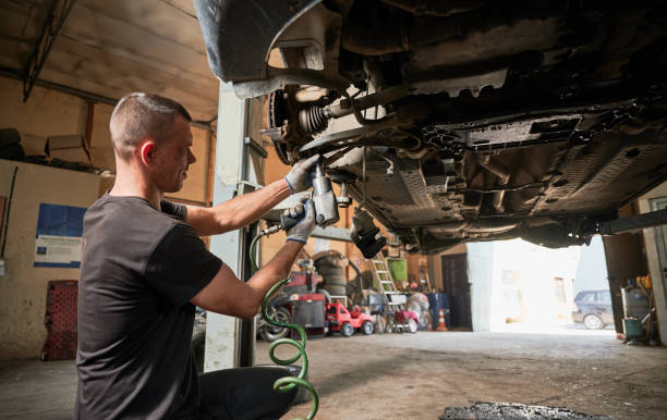 istock Mechanic, engineer servicing car in garage, auto center. 1466607210