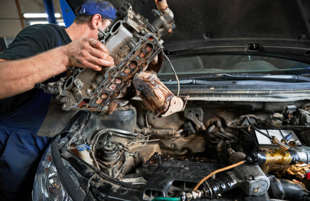 istock Repairman, mechanic worker making diagnostics of car, examining engine. 1466607292