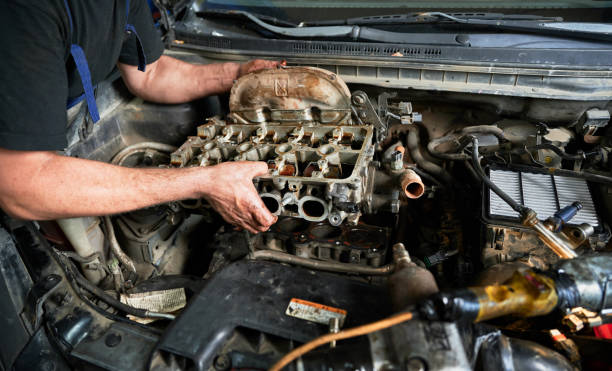 istock Repairman, mechanic worker making diagnostics of car, examining engine. 1466607296