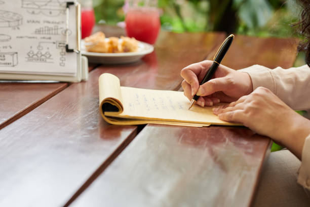 istock Businesswoman Taking Notes at Meeting 1466609017