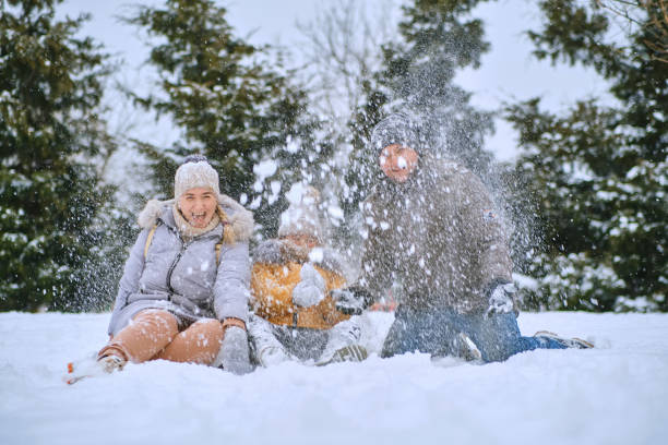 istock happy kid and parents in the winter 1466609537