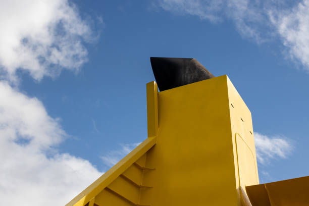 istock Yellow boat chimney and a cloudy sky 1466610264