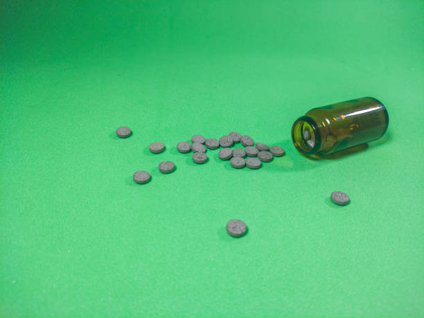 istock a large number of scattered pills, pharmacy bottle 1466612142