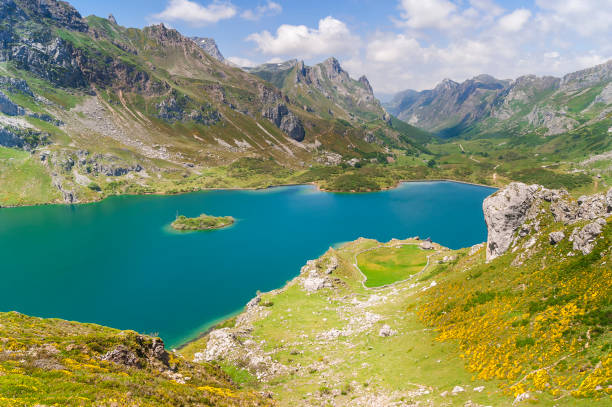 View from above of a part of the valley lake and its mountains in Somiedo This beautiful and simple route starts from the town called Lake Valley in Somiedo, Asturias, Spain. bioreserve stock pictures, royalty-free photos & images