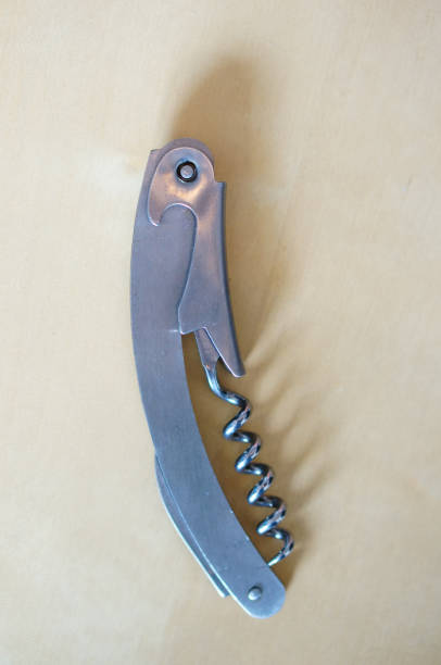 istock Top view of the wine corkscrew on a white surface 1466613549
