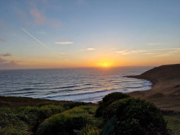 istock sunset view over the ocean from a cliff near a beach 1466613881