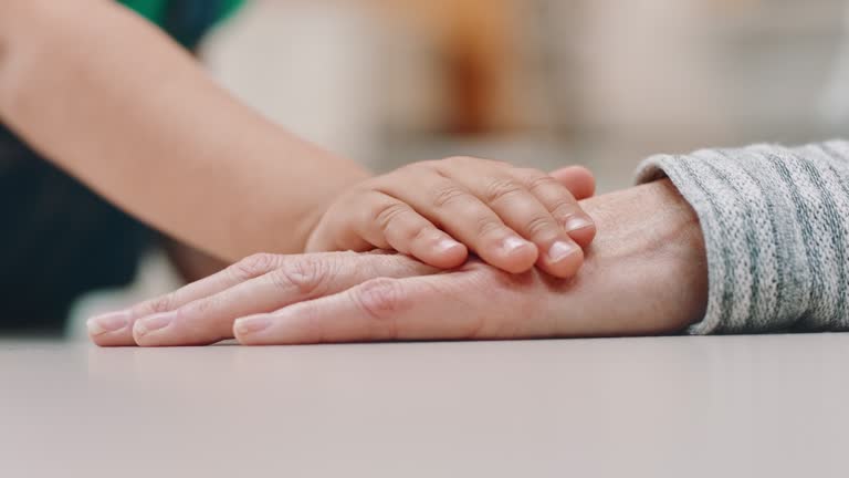 Empathy, child and elderly hand together with support or love in old age, retirement and family bonding. Hands touch, quality time and grandmother with grandchild spending a weekend together for hope