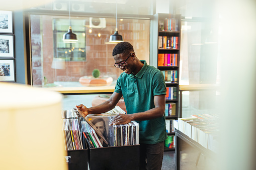 Man looking at record in store