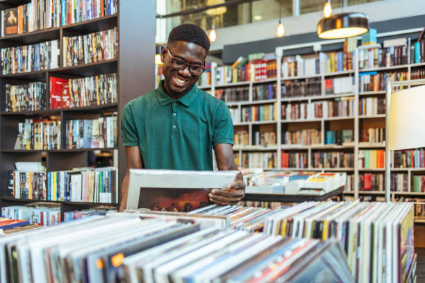 istock Young Man Buying Record Albums 1466614203