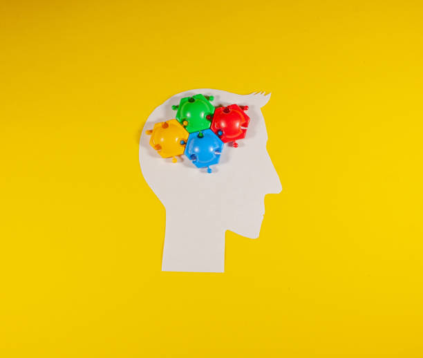 istock a lot of mental work for a man. puzzles on a paper head 1466616321