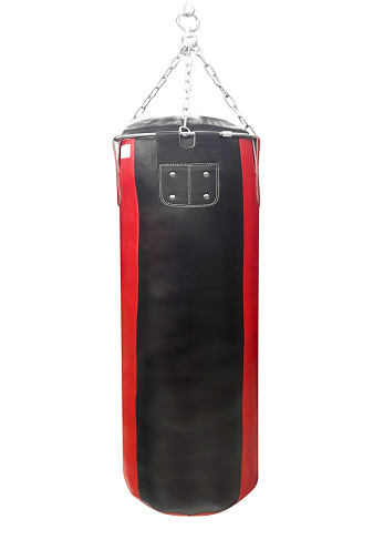 Black punching leather bag isolated on a white background. Boxing equipment.
