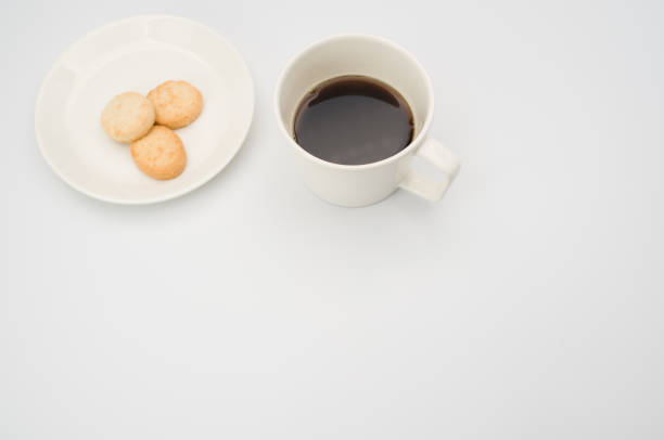 istock cup of black coffee and coconut biscuits  in a plate 1466617279