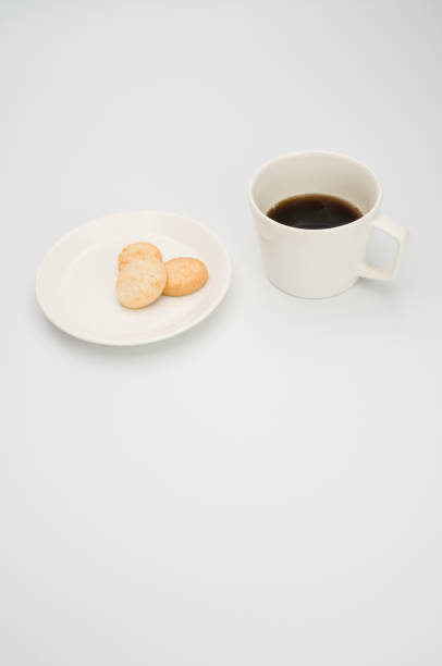 istock cup of black coffee and coconut biscuits  in a plate 1466617287