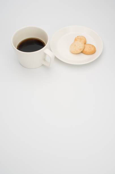 istock cup of black coffee and coconut biscuits  in a plate 1466617311