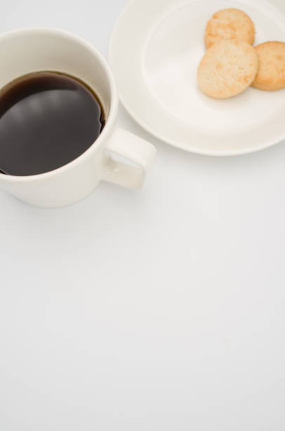 istock cup of black coffee and coconut biscuits  in a plate 1466617315