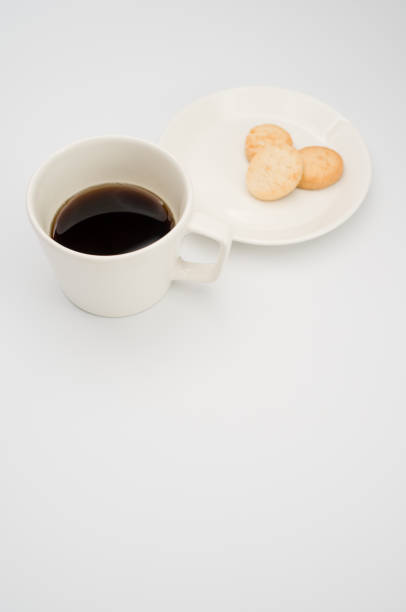 istock cup of black coffee and coconut biscuits  in a plate 1466617316