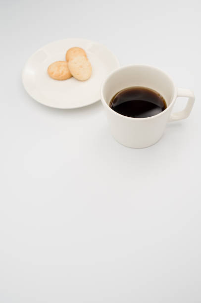 istock cup of black coffee and coconut biscuits  in a plate 1466617324