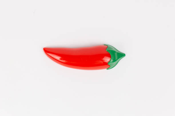istock plastic toy chili pepper on a white background 1466620540