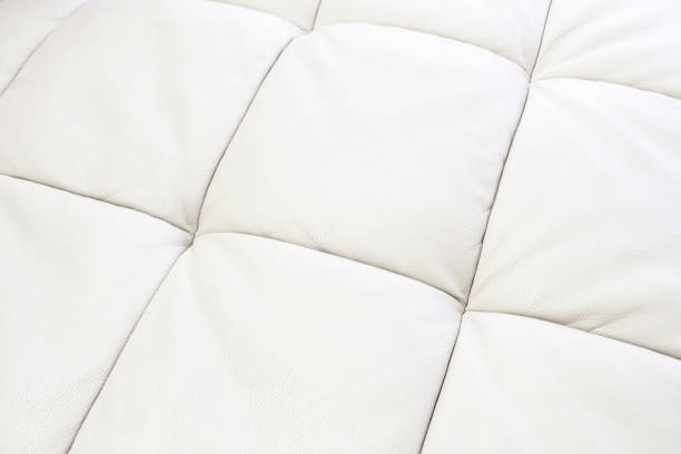 istock White leather texture. Part of perforated leather details. Orange perforated leather texture background. Texture, artificial leather with diagonal stitching. 1466620622