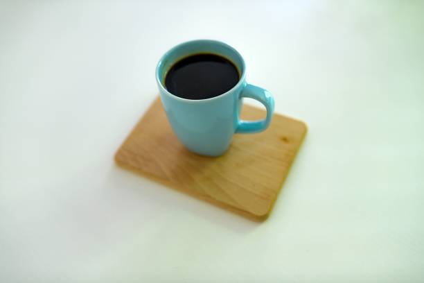A closeup of coffee in a blue cup