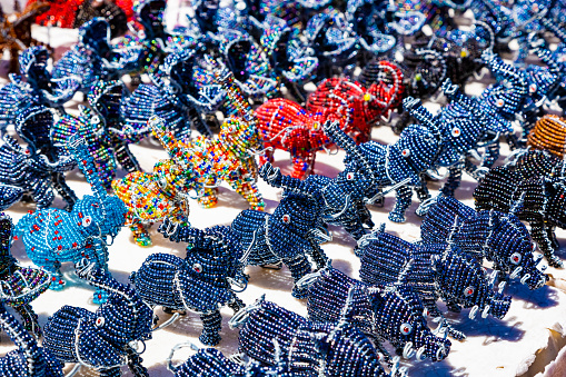 African curios of animals made from beads and wire at street flea market