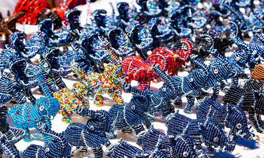 African curios of animals made from beads and wire at street flea market