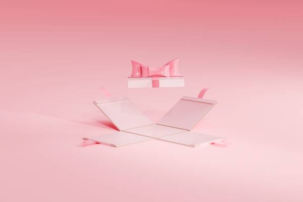 istock 3d of a pink opened gift box with bow ribbon hovering above. Product placement template 1466624721
