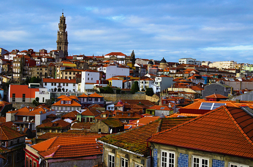 Picturesque aerial landscape view of traditional ancient colorful buildings with red tile roofs in Ribeira district in Porto old town. Travel and tourism concept. UNESCO World Heritage Site.