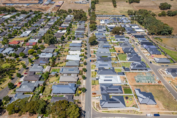 istock Aerial view new rural housing development alongside established housing suburb 1466625602