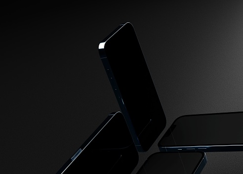 A 3D rendering of smartphones with black screens mockup on a black background.