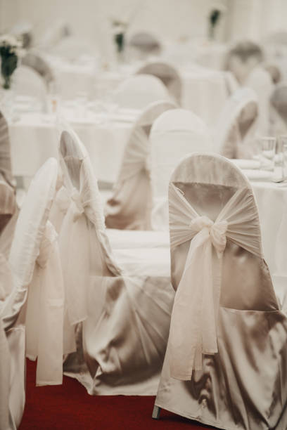 istock Selective focus shot of white wedding tables and chairs with b 1466628059