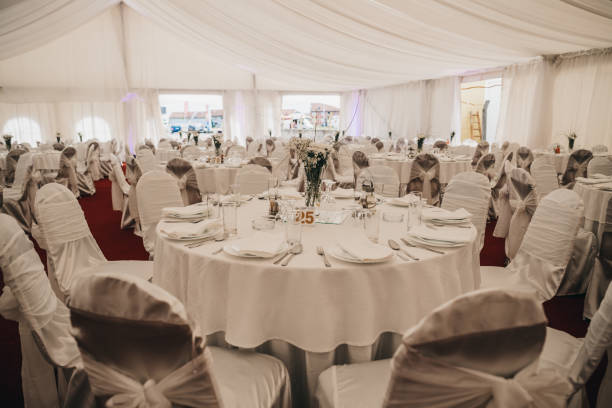 istock Shot of white wedding tables with numbers and chairs 1466628077