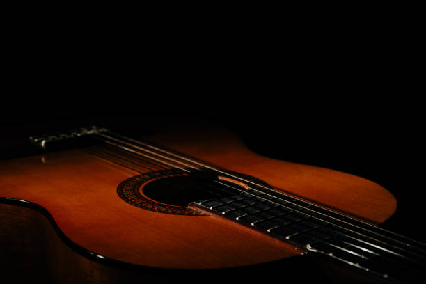 istock Classical acoustic guitar. On an isolated black background. 1466632521