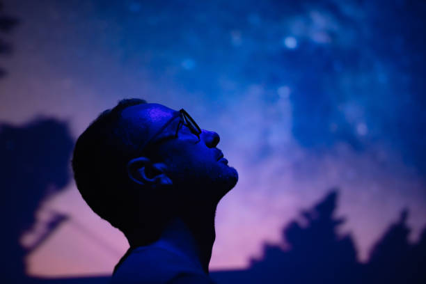 Silhouette of a man with Milky Way starry skies. stock photo