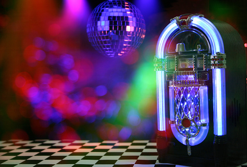 A horizontal shot of Jukebox, disco ball and bokeh composite in the bar