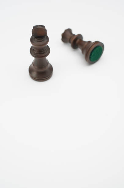 istock Vertical shot of black chess pieces isolated on a white background 1466635954