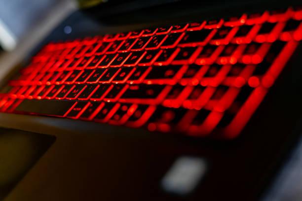 istock Closeup of a laptop keyword with red light 1466636981