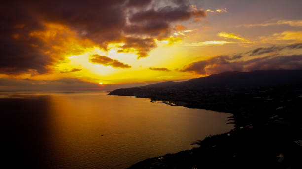 istock Stunning view of an orange sunset sky reflected on a tranquil sea 1466637312