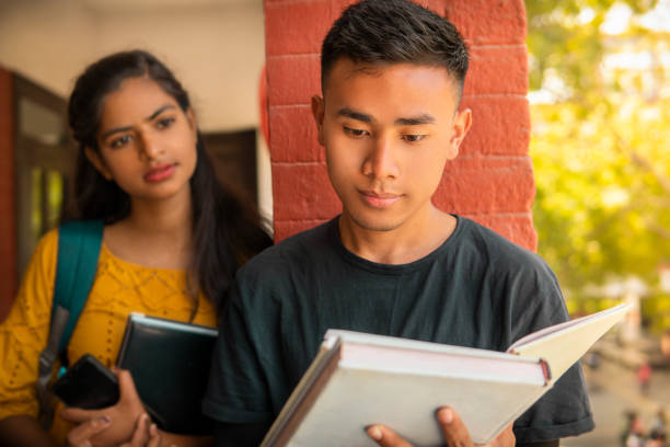 istock Multiethnic college student friends studying together at campus. 1466637590