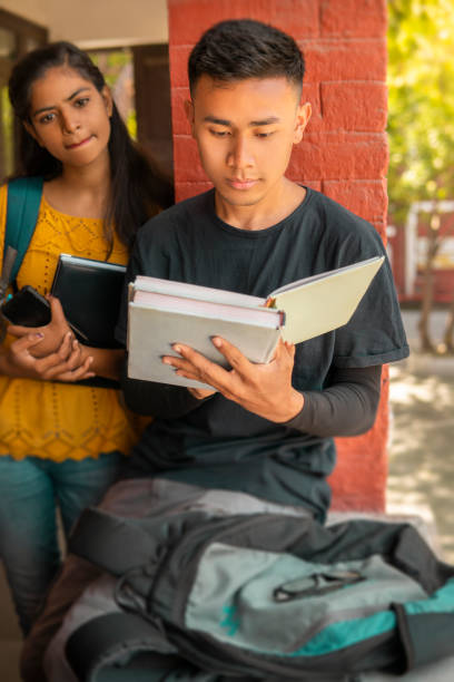istock Multiethnic college student friends studying together at campus. 1466637603