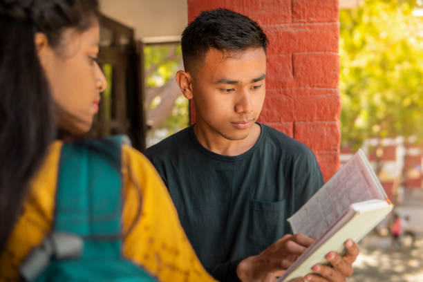 istock Multiethnic college student friends studying together at campus. 1466637613