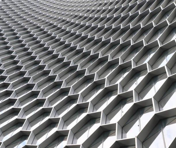 istock Abstract building wallwith hexagonal honeycombs of concrete 1466637728