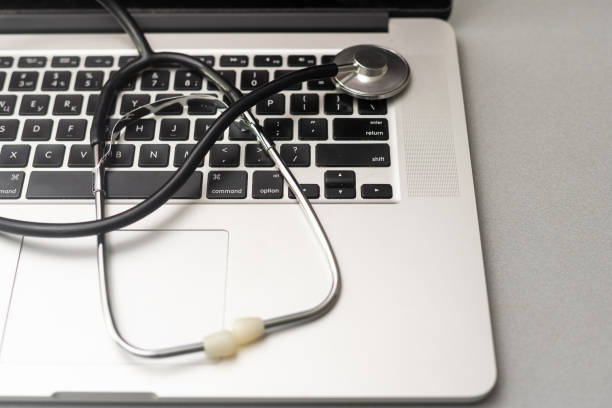 istock Stethoscope on the keyboard of laptop 1466639800