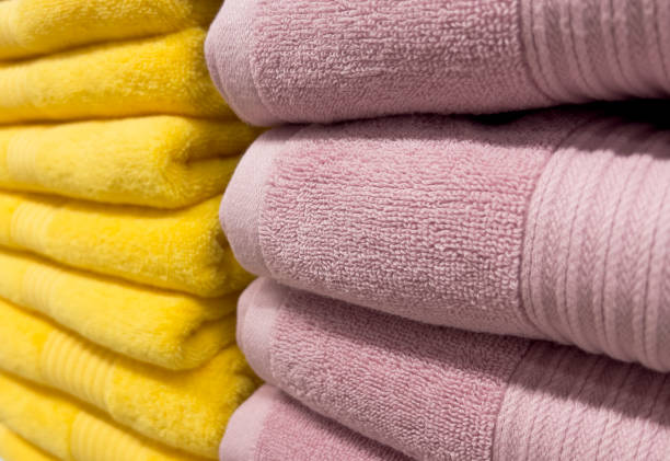 istock Stack of colorful towels. Fresh new fluffy towels. Pile stacked colored fabric towels. Stack colored cotton towels 1466640671
