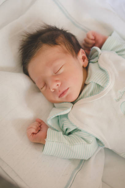 istock Adorable Caucasian baby boy sleeping in the cradle 1466640808